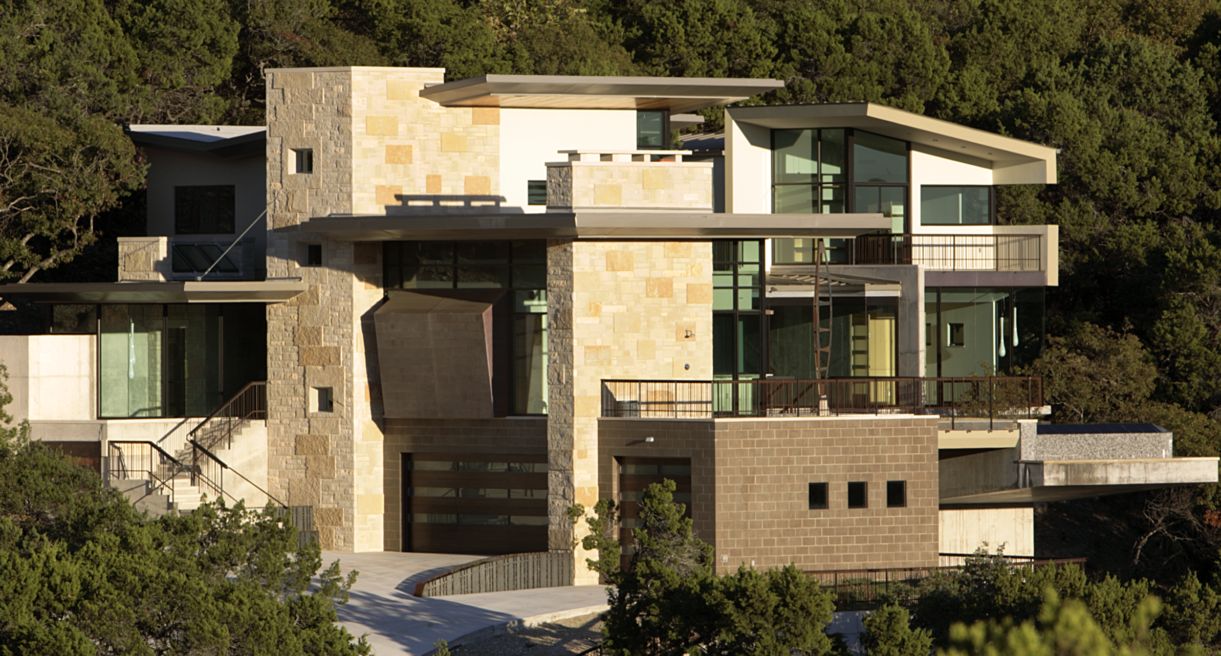 Contemporary Residential Stone home with stone exterior and clean lines